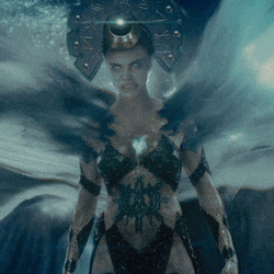a woman in a costume with a shield on her head
