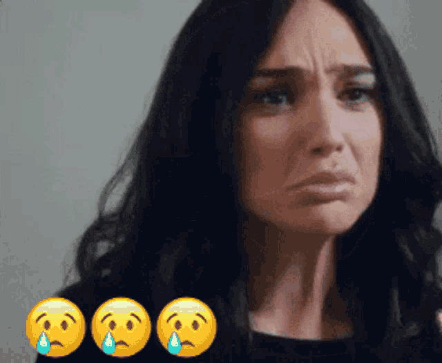 a woman with tears coming out of her eyes is surrounded by crying emojis