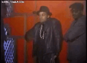 a group of men are dancing in front of a red wall with the words " mxpac tumblr.com " on the bottom