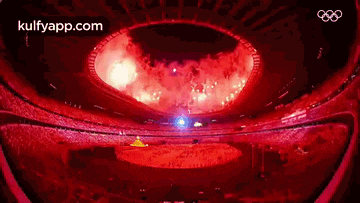 an aerial view of a stadium with fireworks going off in the middle .