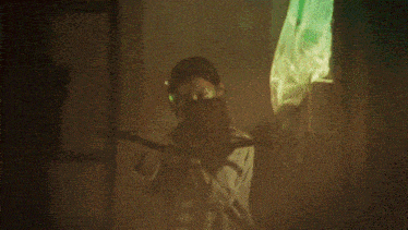 a woman with a mask on her face is holding a green object above her head