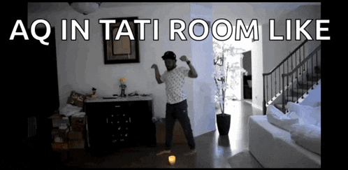 a man is dancing in a room with the words aq in tati room like