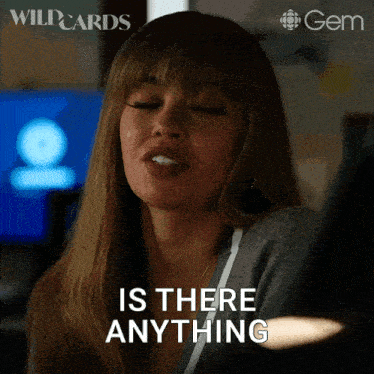 a woman says " is there anything " in front of a computer monitor