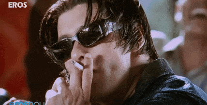 a man wearing sunglasses smoking a cigarette with eros written on the bottom