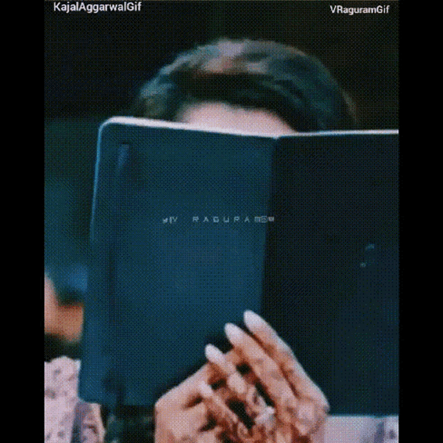 a woman is reading a book and making a funny face .