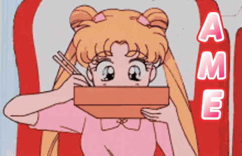 a girl in a pink shirt is holding a box with chopsticks in front of her face and the letters a and m are visible
