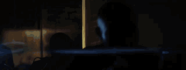 a blurred image of a blue background with a white object in the middle