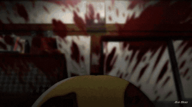 a blurred image of a room with blood stains on the wall