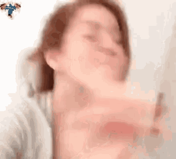 a close up of a woman 's face with a blurred background