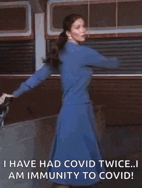 a gif of a woman dancing with the words i have had covid twice