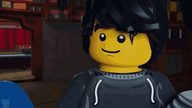 a close up of a lego character with a black hair