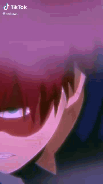 a close up of a person 's face with a purple background and red hair .