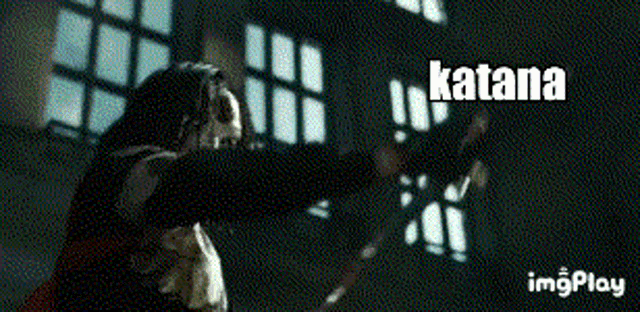 a woman is holding a sword and the word katana is on the bottom right