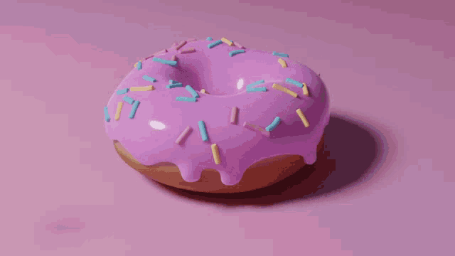 a donut with pink frosting and sprinkles on a pink background .