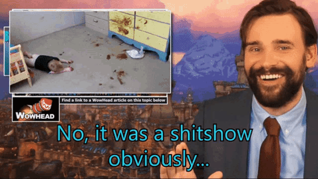 a man in a suit and tie is pointing at a wowhead ad