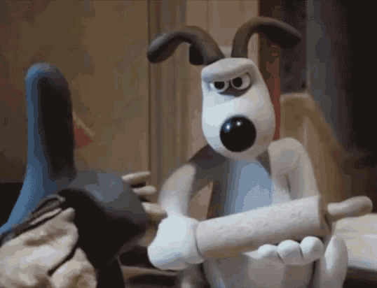 a cartoon dog is holding a rolling pin while standing next to a duck