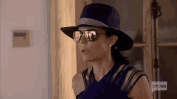 a woman wearing a hat and sunglasses is featured on bravo