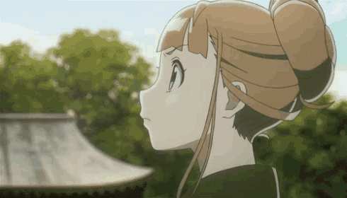 a close up of a girl 's face in front of trees
