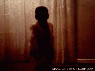 a silhouette of a person standing in front of a window with the words make gifs at gifsoup.com below