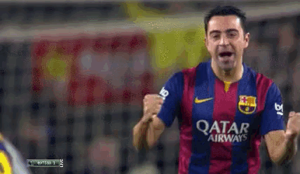 a soccer player wearing a qatar airways jersey is celebrating