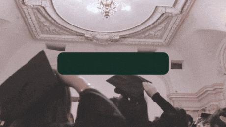 a group of graduates holding their caps in the air