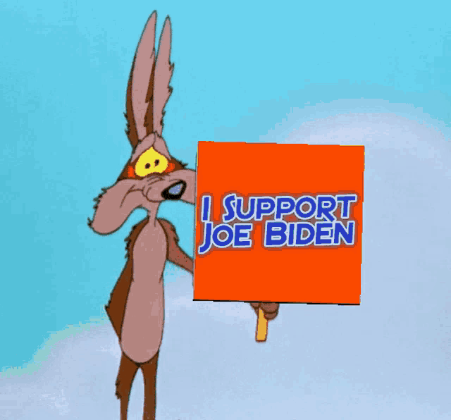 a cartoon coyote is holding a sign that says i support joe biden
