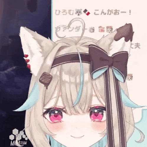 a girl with a cat ear and a bow on her head