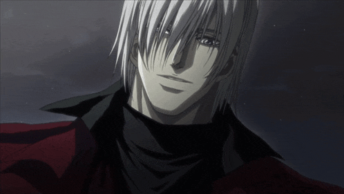 a man with white hair is wearing a black scarf