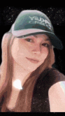 a woman is wearing a green hat that says yeda on it