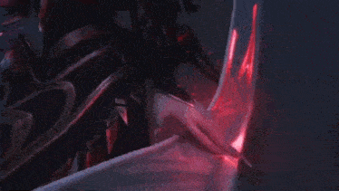 a close up of a person holding a red object in their hands .