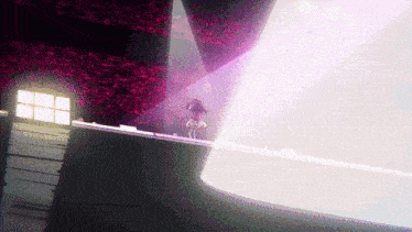 a person standing in a dark room with a purple light shining on them