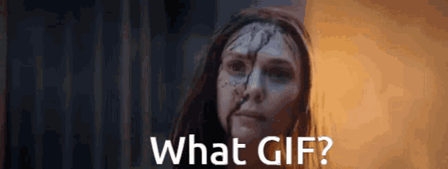 a woman with blood on her face has the words what gif below her