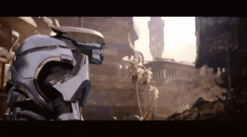 a robot with a gun is standing in front of a building .