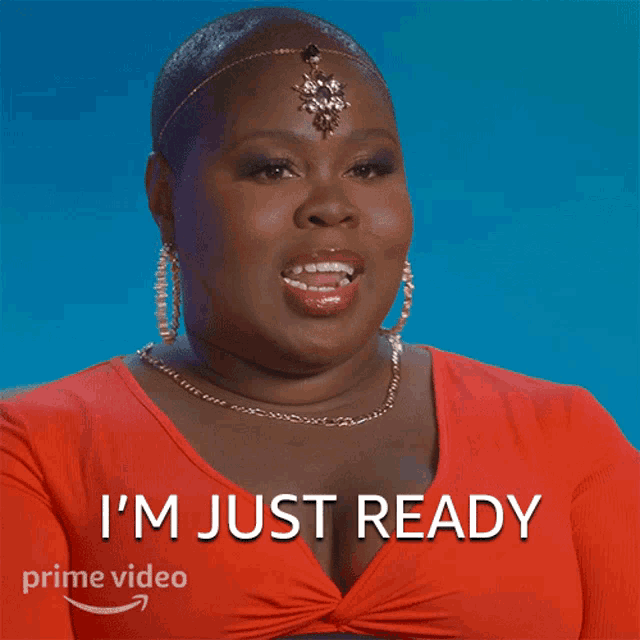 a woman in a red top says i 'm just ready on a blue background