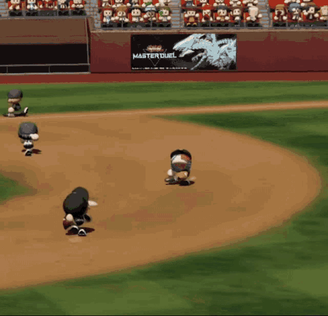 a baseball game is being played in front of a banner that says master duel on it
