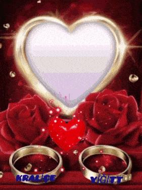 a picture of a heart surrounded by red roses and a couple of wedding rings