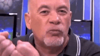 an older man with a beard is making a funny face .