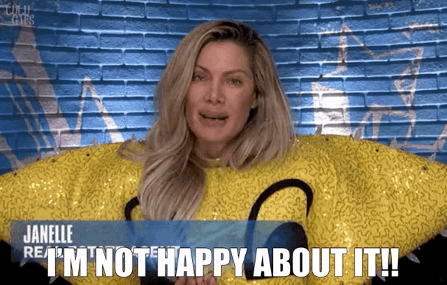 a woman in a yellow sweater says " janelle i 'm not happy about it "