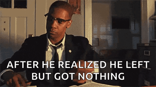 a man in a suit and tie is sitting at a desk with the words after he realized he left but got nothing written below him