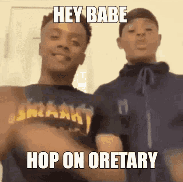 two young men are standing next to each other and one of them is wearing a shirt that says hey babe hop on oretary