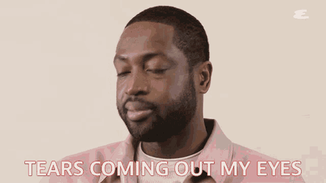 a man in a pink jacket says tears coming out his eyes