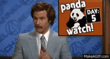 a man in a suit and tie stands in front of a panda watch sign