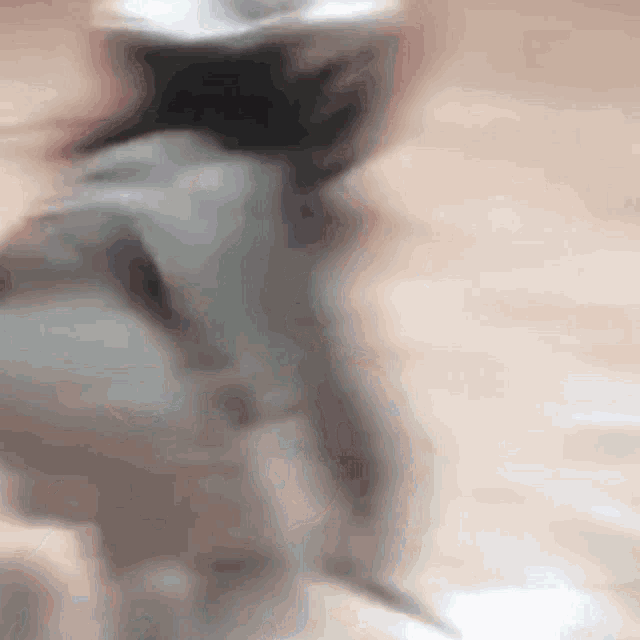 a blurry image of a person walking on a street