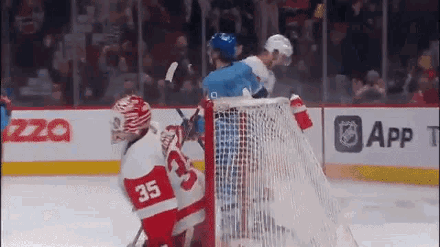 a hockey player with the number 35 on his jersey is on the ice