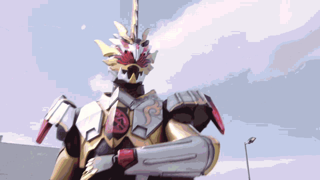 a statue of a robot with a red circle on the chest