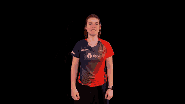 a woman wearing a red and blue shirt with the word apd on the front