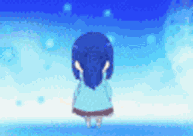 a girl with blue hair is standing in front of a blue sky with clouds .