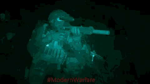 a soldier is holding a gun in a dark room with #modernwarfare written in red