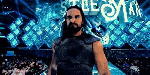 a wrestler stands in front of a sign that says ' castlevania '
