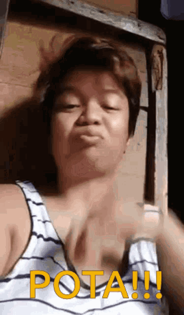 a woman in a striped tank top is making a funny face and says pota